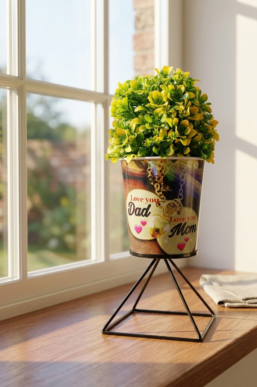 Artificial Plant in “Love You Mom Dad” Printed Metal Pot with Stand | Decorative Gift Plant for Parents